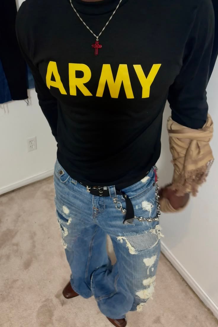 Black ARMY top with distressed wide-leg jeans, silver chain and brown boots.